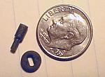 Tiny elastomer grommet and polycarbonate axle pin.