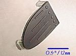 Snap actuator with a thin layer of elastomer over polycarbonate.